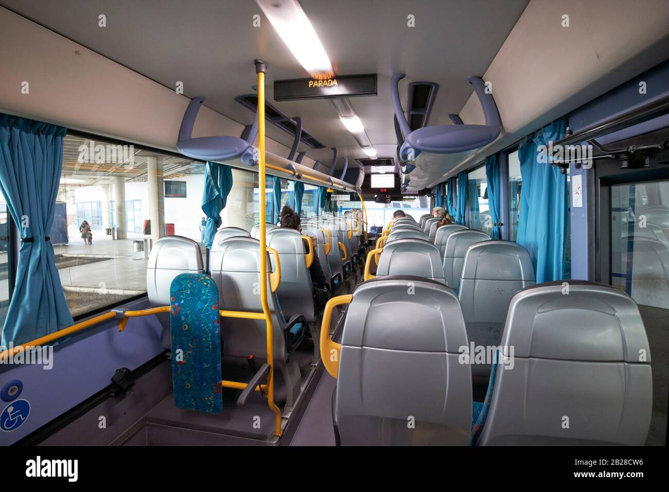 passengers boarding airport bus service in playa blanca Lanzarote canary islands spain Stock Photo