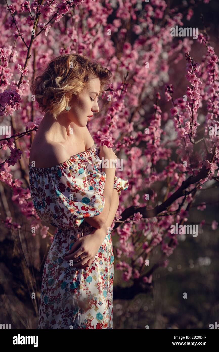 fashion outdoor photo of gorgeous young woman in elegant dress posing ...