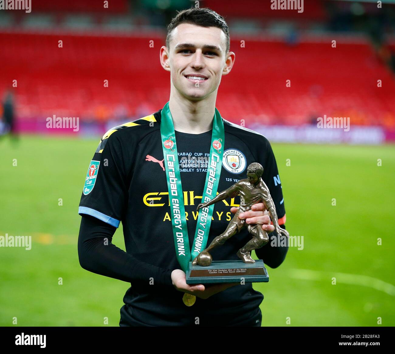 London, UK. 1st Mar 2020. Manchester City's Phil Foden with men of the MatchCarabao Cup Final between Aston Villa and Manchester City at Wembley Stadium, London, England on 01 March 2020 Credit: Action Foto Sport/Alamy Live News Stock Photo