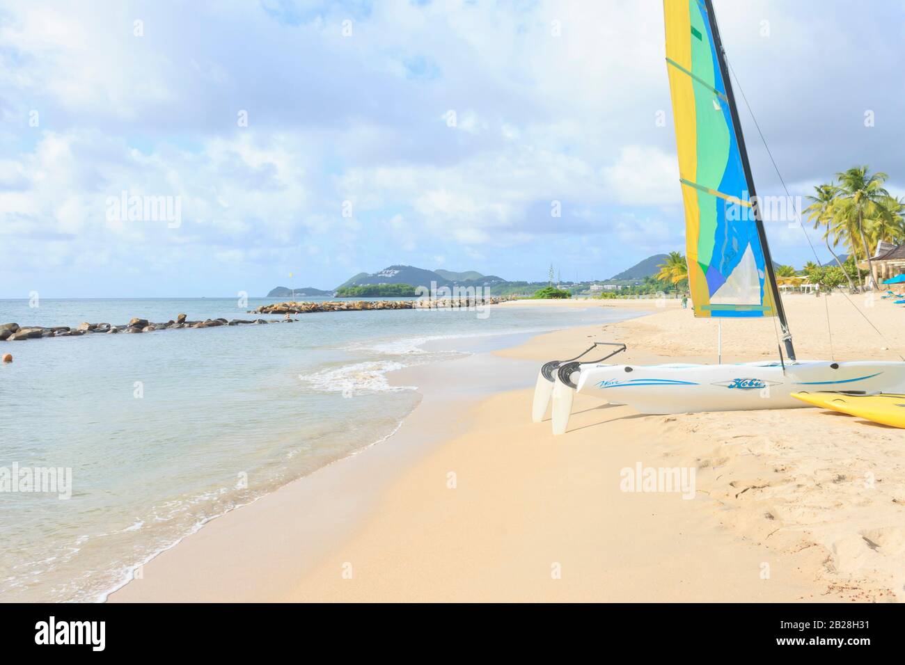 Castries, Saint Lucia - July 12, 2016. Hobie Sailing Catamaran on Vigie beach ready for some action on a bright sunny cloudy day near the water's edge Stock Photo