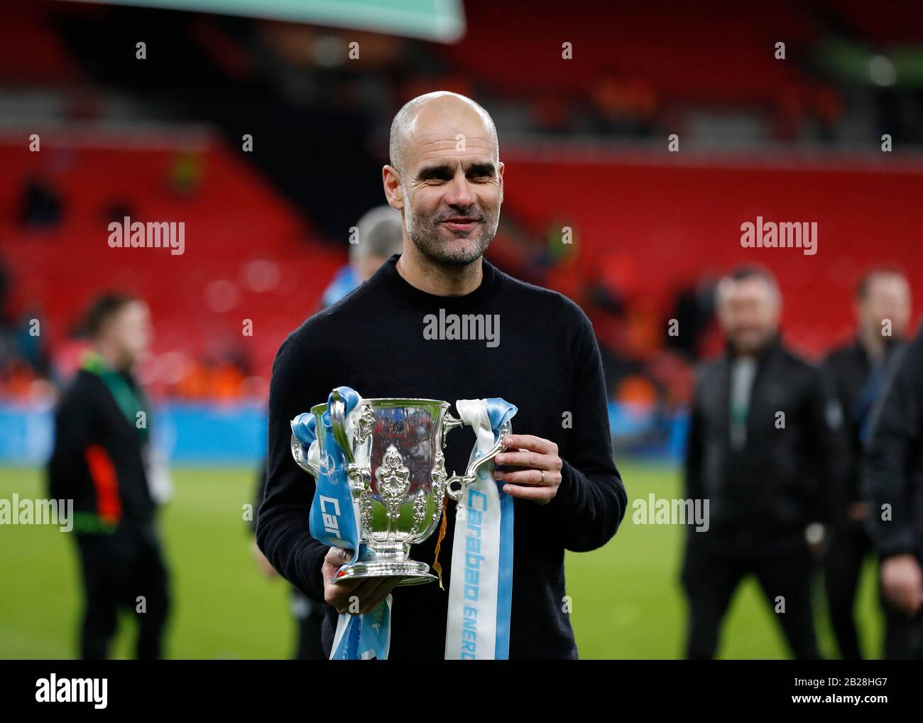 Wembley Stadium London Uk 1st Mar 2020 Carabao Cup Final League Cup Aston Villa Versus Manchester City Manchester City Manager Pep Guardiola Celebrating Posing With The Efl Cup Trophy In Front Of