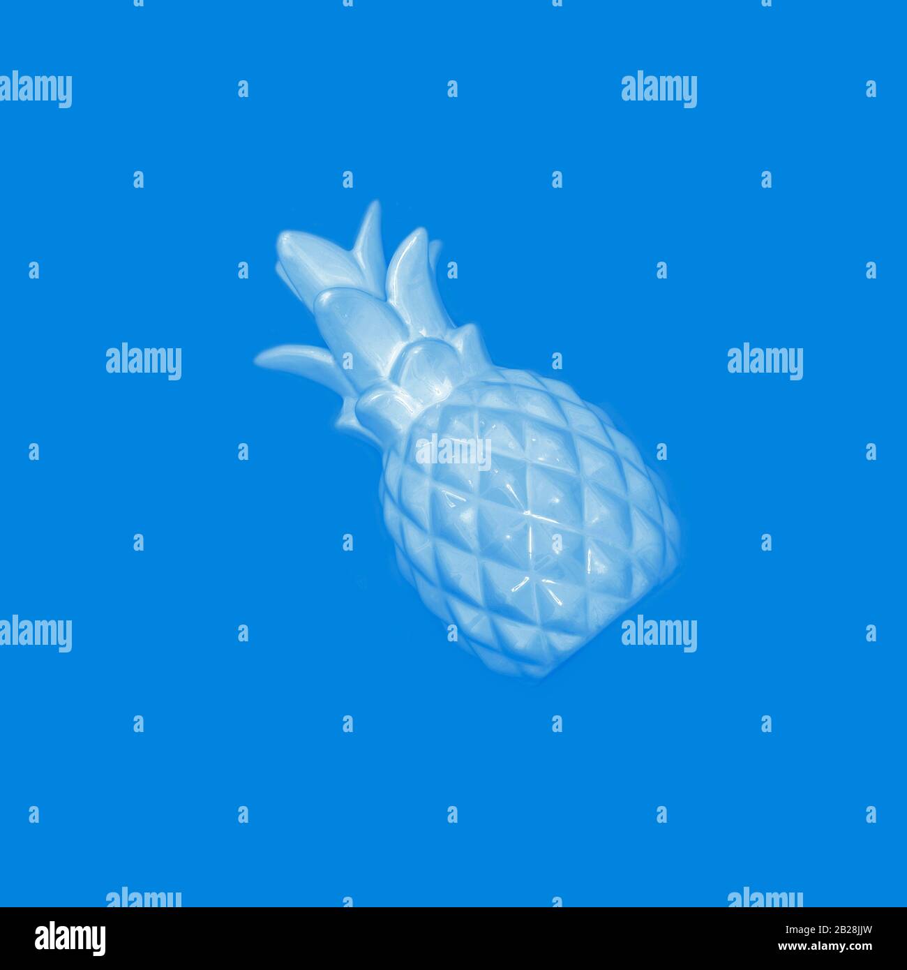 Blue pineapple on a pink background. Stock Photo