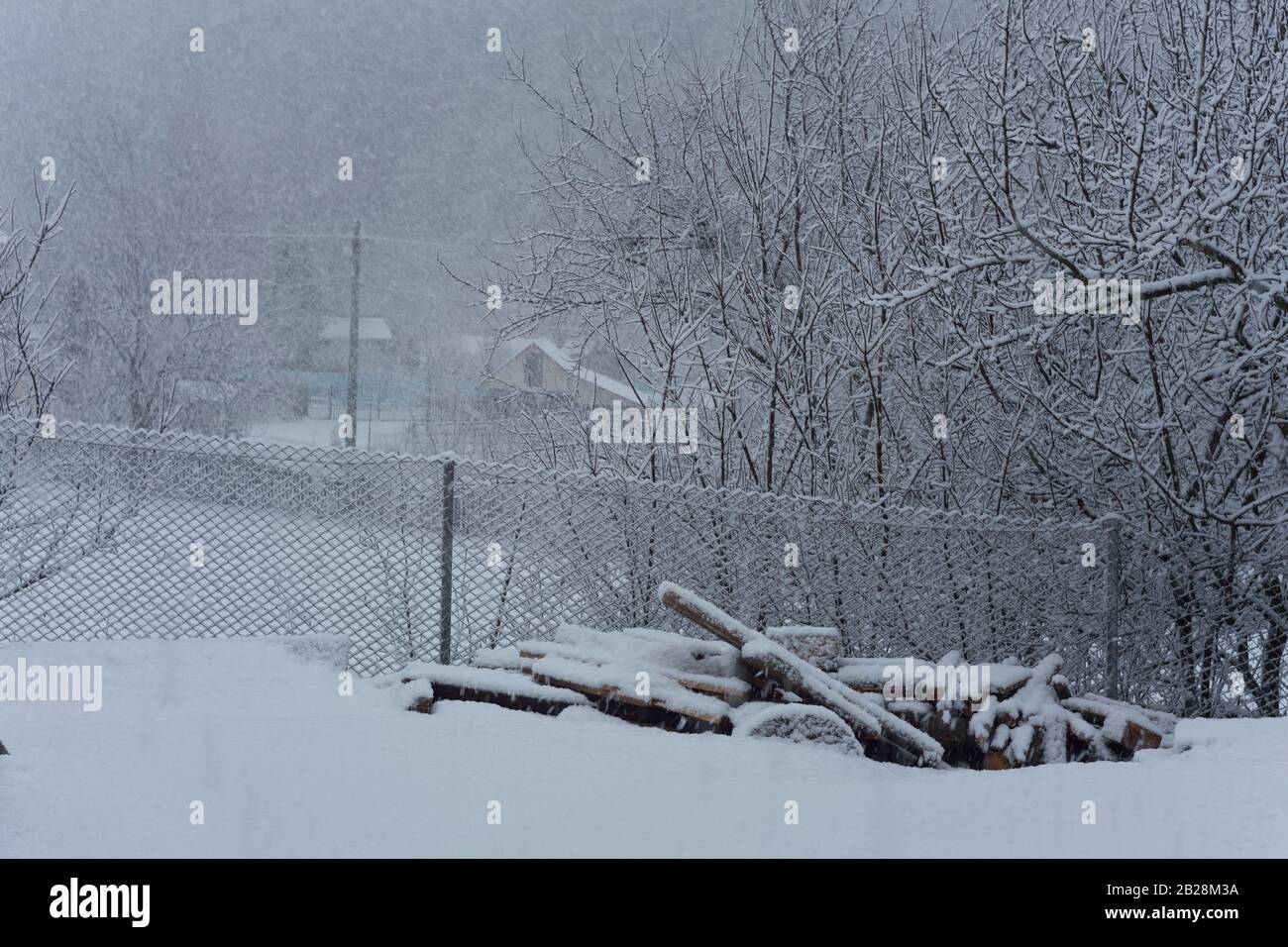 winter scene in rural landscape, snowing in the village Stock Photo Alamy