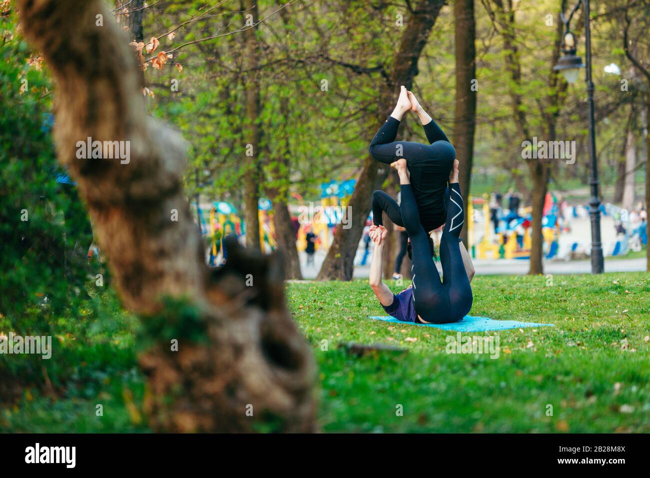 Lviv, Ukraine - April 18, 2019: people make fitness exercises outdoors Stock Photo