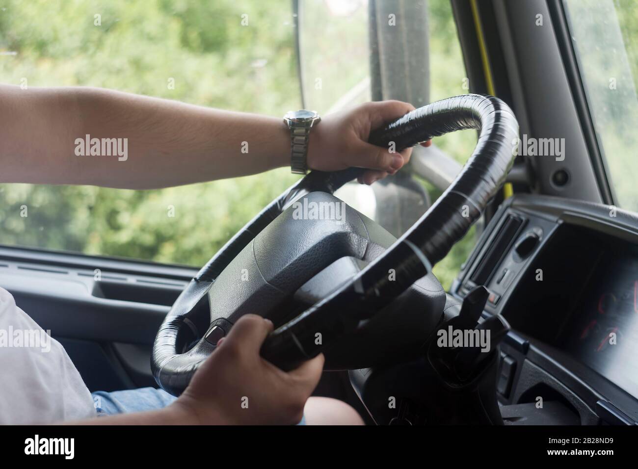 man with hands on truck steering wheel. driving on the road Stock Photo ...
