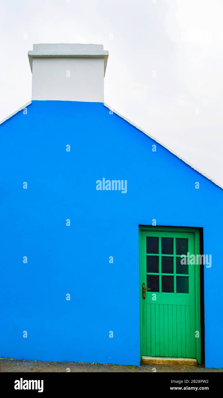 Blue house facade with green front door, Burren, West Coast, County Clare, Republic of Ireland Stock Photo