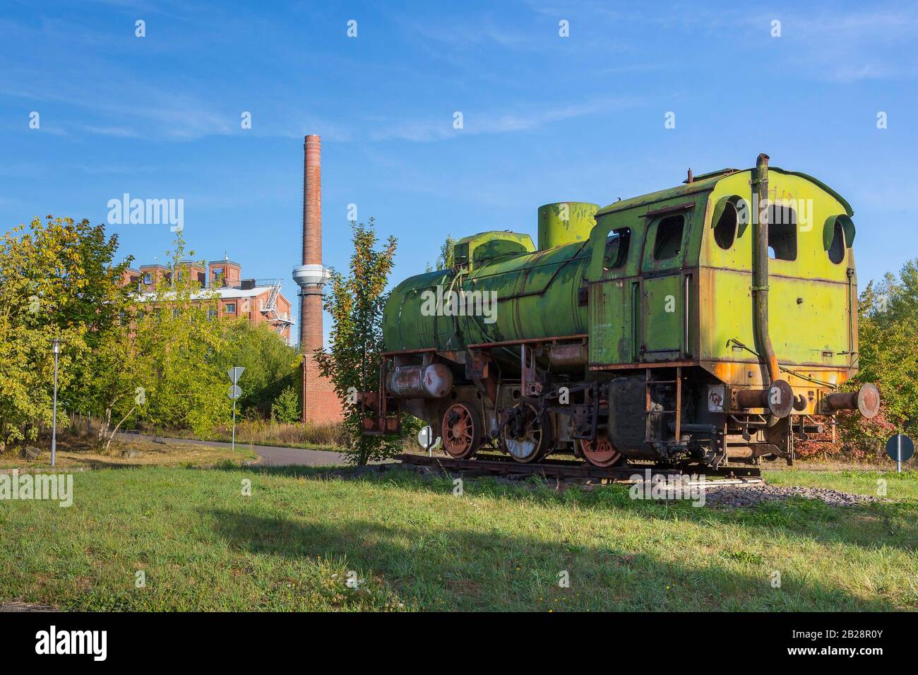 Old locomotive and factory buildings, former briquette factory Neukirchen, Borna, Saxony, Germany Stock Photo