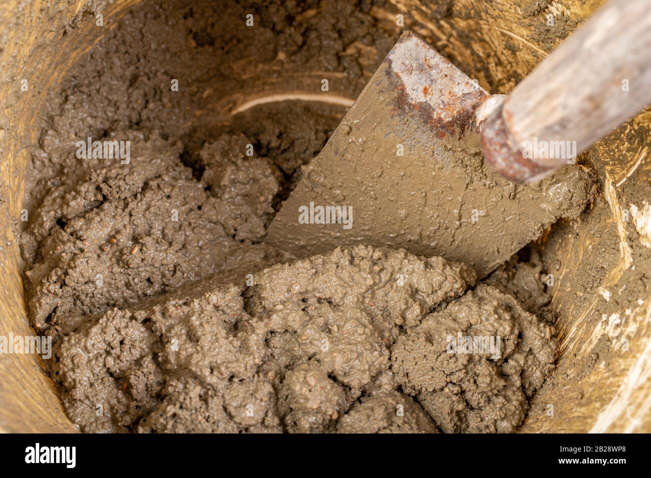 Trowel and mortar prepared for masonry. Accessories for building houses. Light background Stock