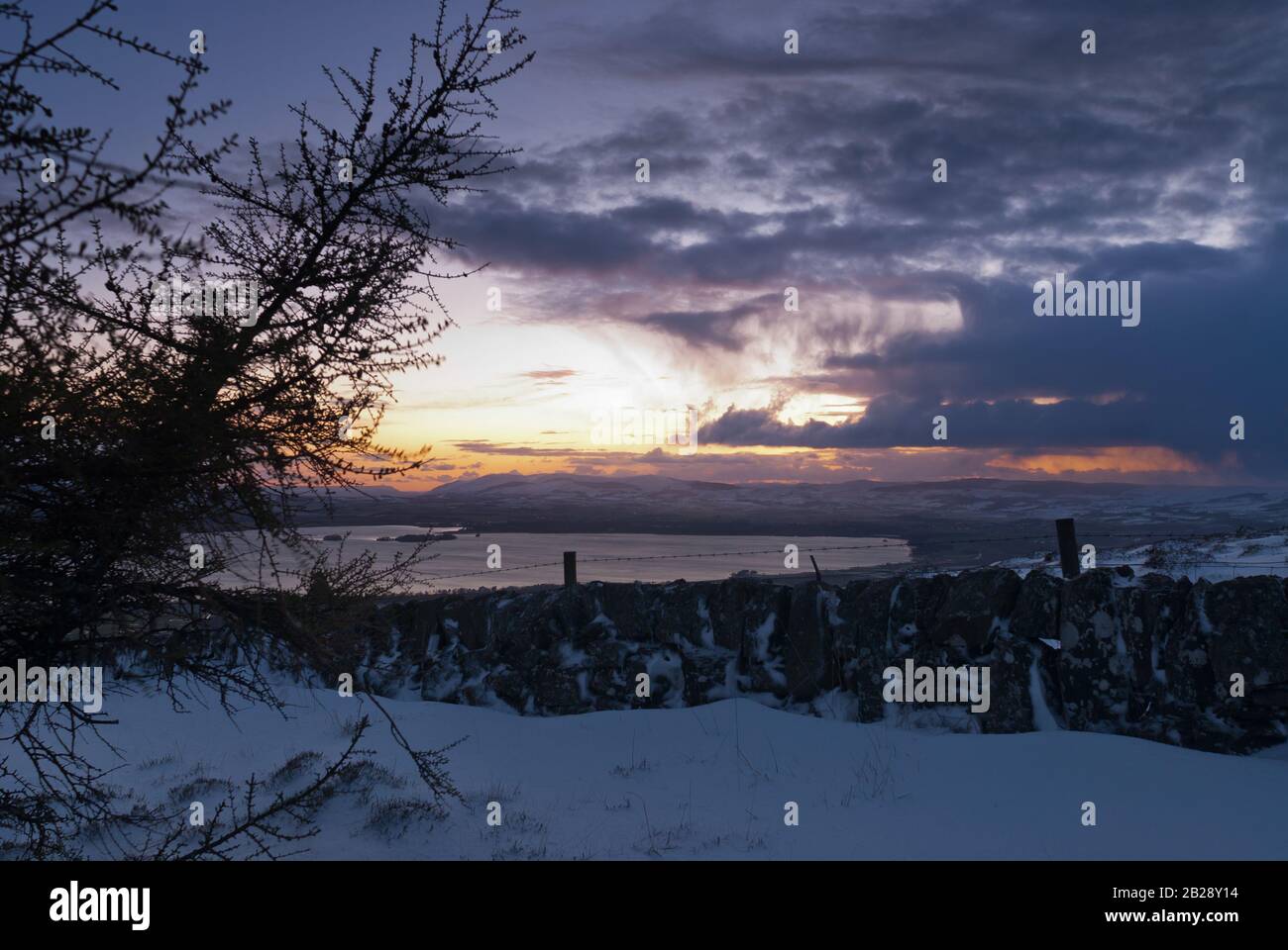 A winter sunset scene from the Lomond Hills of Fife, overlooking Loch Leven, Kinross-shire. Stock Photo