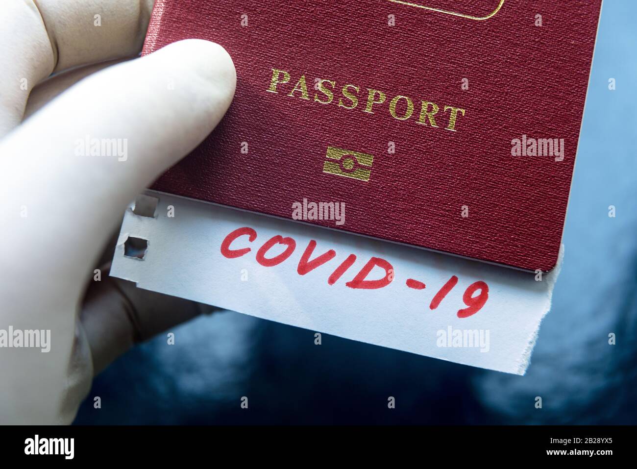Coronavirus and travel concept. Note COVID-19 and passport. Novel corona virus outbreak. The spread of epidemic from Wuhan, China. Border control and Stock Photo