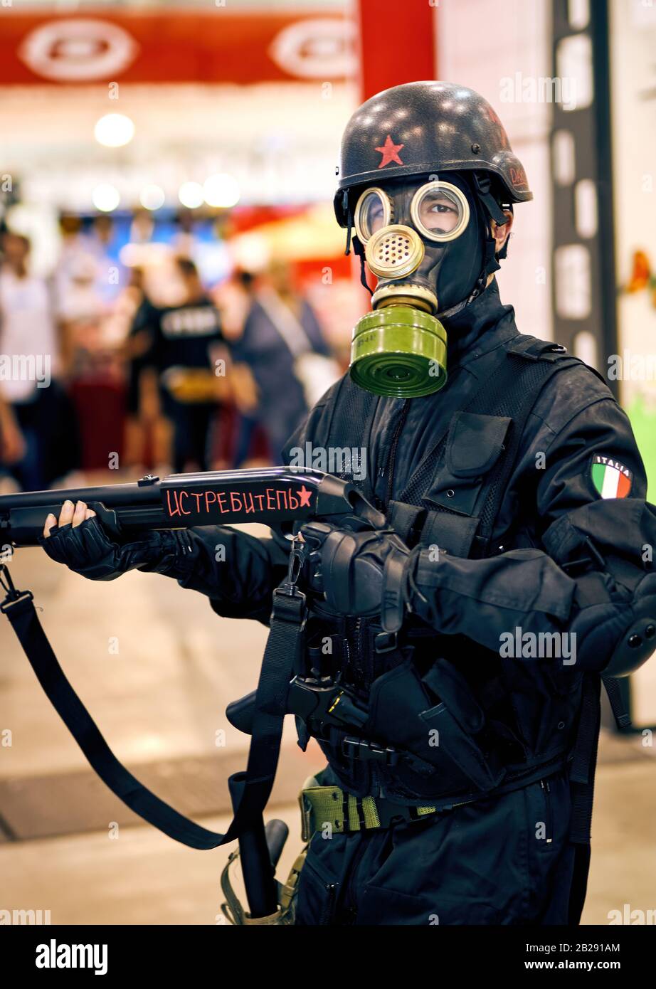 Italian Soldier Cosplayer with Fake Gas Mask and Machine Gun at ROMICS Festival (Rome Comics), Twice a Year the Iconic Gathering of Cosplay Stock Photo