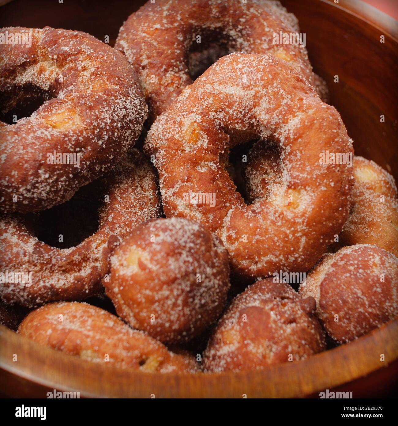 Close Up of Donuts in a Wooden Bowl Stock Photo