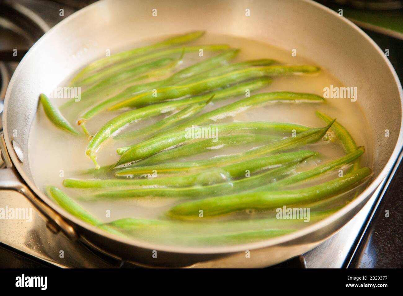 Green beans cooking on a stove Stock Photo Alamy