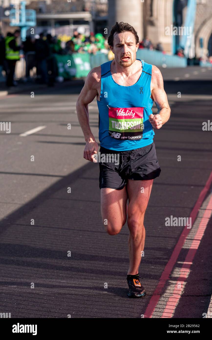 Chris Thompson racing in the Vitality Big Half half marathon crossing Tower Bridge, London, UK, finishing second. Aldershot Farnham & District runner Stock Photo