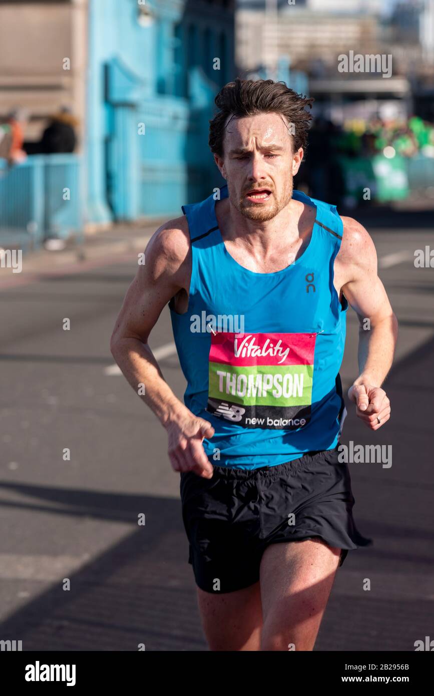 Chris Thompson racing in the Vitality Big Half half marathon crossing Tower Bridge, London, UK, finishing second. Aldershot Farnham & District runner Stock Photo
