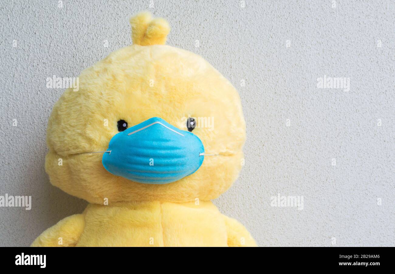 Download Close Up Of A Yellow Plush Toy Animal Wearing A Blue Medical Face Mask With Copy Space Stock Photo Alamy PSD Mockup Templates