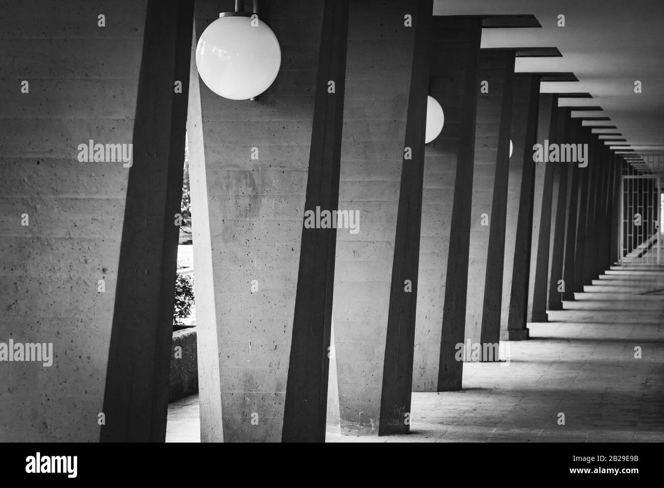 Outdoor hallway with columns in black and white Stock Photo