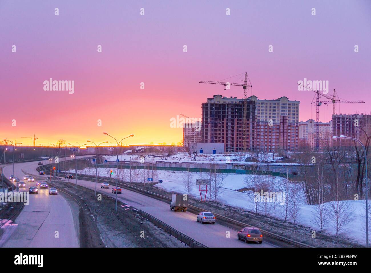 Kemerovo, Russia - march 2019, bypass with road signs - Stroiteley Boulevard, Oktyabrsky Avenue, Rudnichny District. and construction of multi-storey Stock Photo