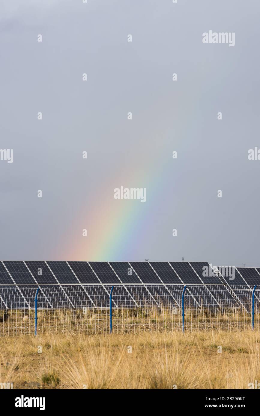 rainbow and photovoltaic panels of solar power station Stock Photo