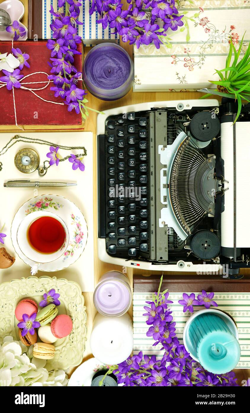 Romantic Vintage Overcrowded Writer S Desk Creative Composition With Old Fashioned Typewriter Books Flowers And Feminine Clutter Stock Photo Alamy