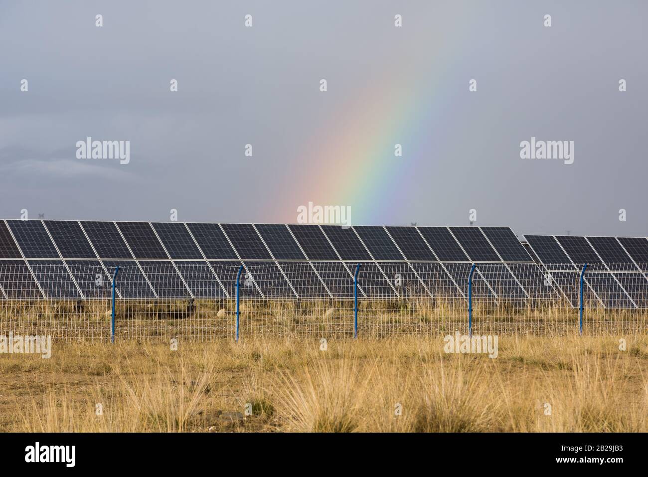 rainbow and photovoltaic panels of solar power station Stock Photo