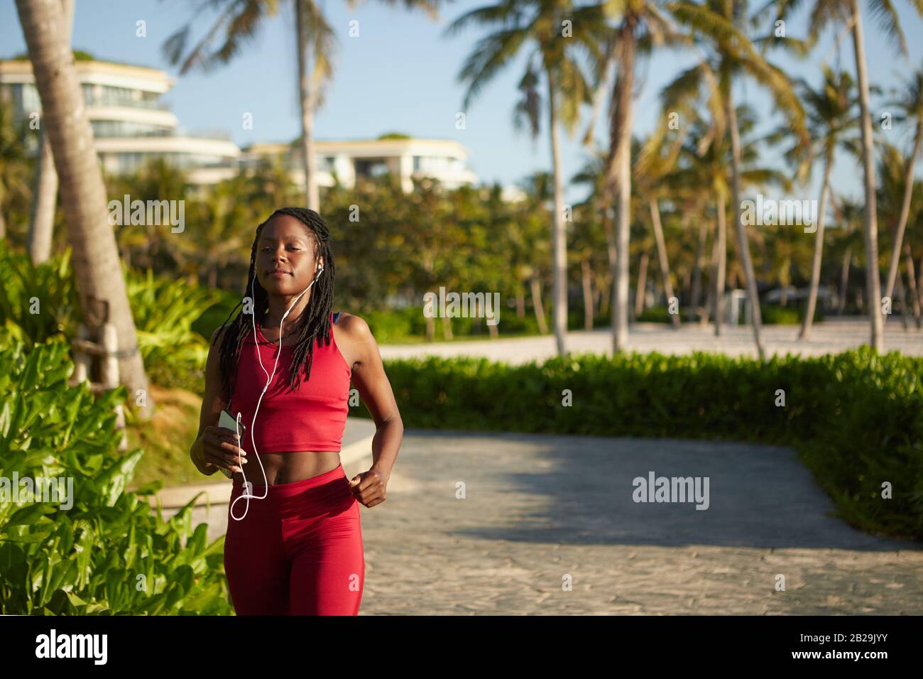 Black woman running outdoors hi-res stock photography and images - Alamy