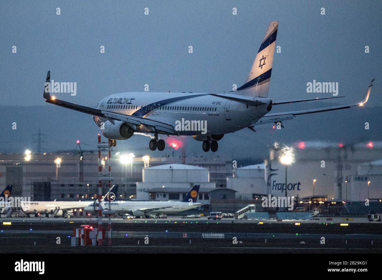 01 March 2020, Hessen, Frankfurt/Main: A passenger plane of the Israeli El-Al lands at Frankfurt Airport after dark. The aviation industry is already feeling the effects of the spread of corona virus. Experts expect massive losses for the airlines. Photo: Boris Roessler/dpa Stock Photo
