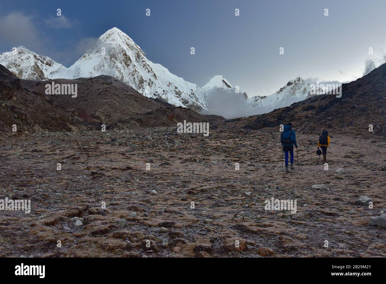 People walking on Everest Base Camp trekking route at Himalayas mountain range in Nepal Stock Photo