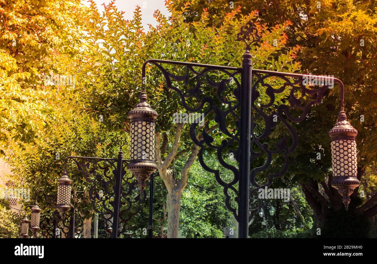 Old retro style lantern made of metal in hand Stock Photo - Alamy