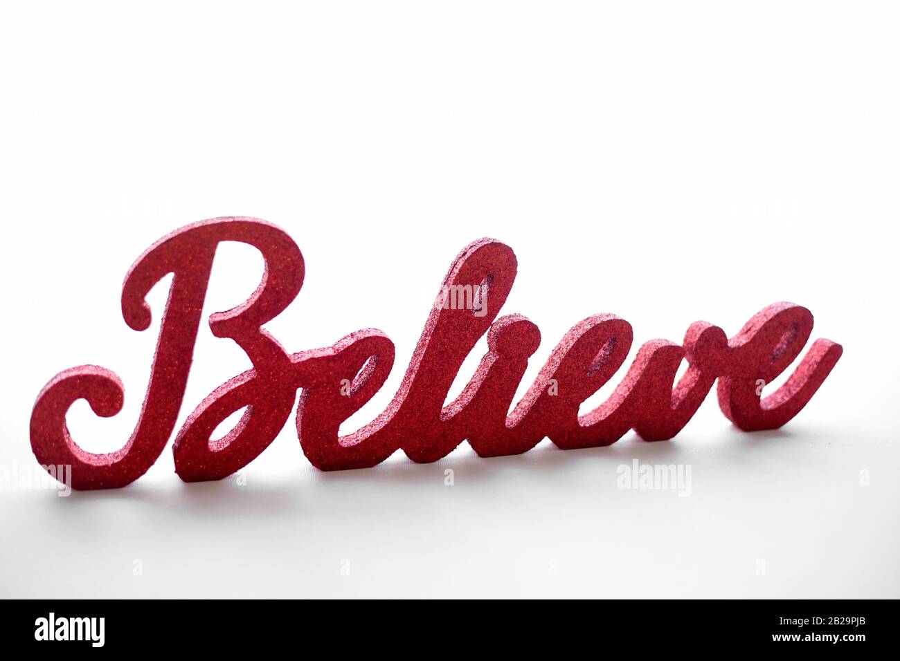 Red believe sign on white background Stock Photo - Alamy