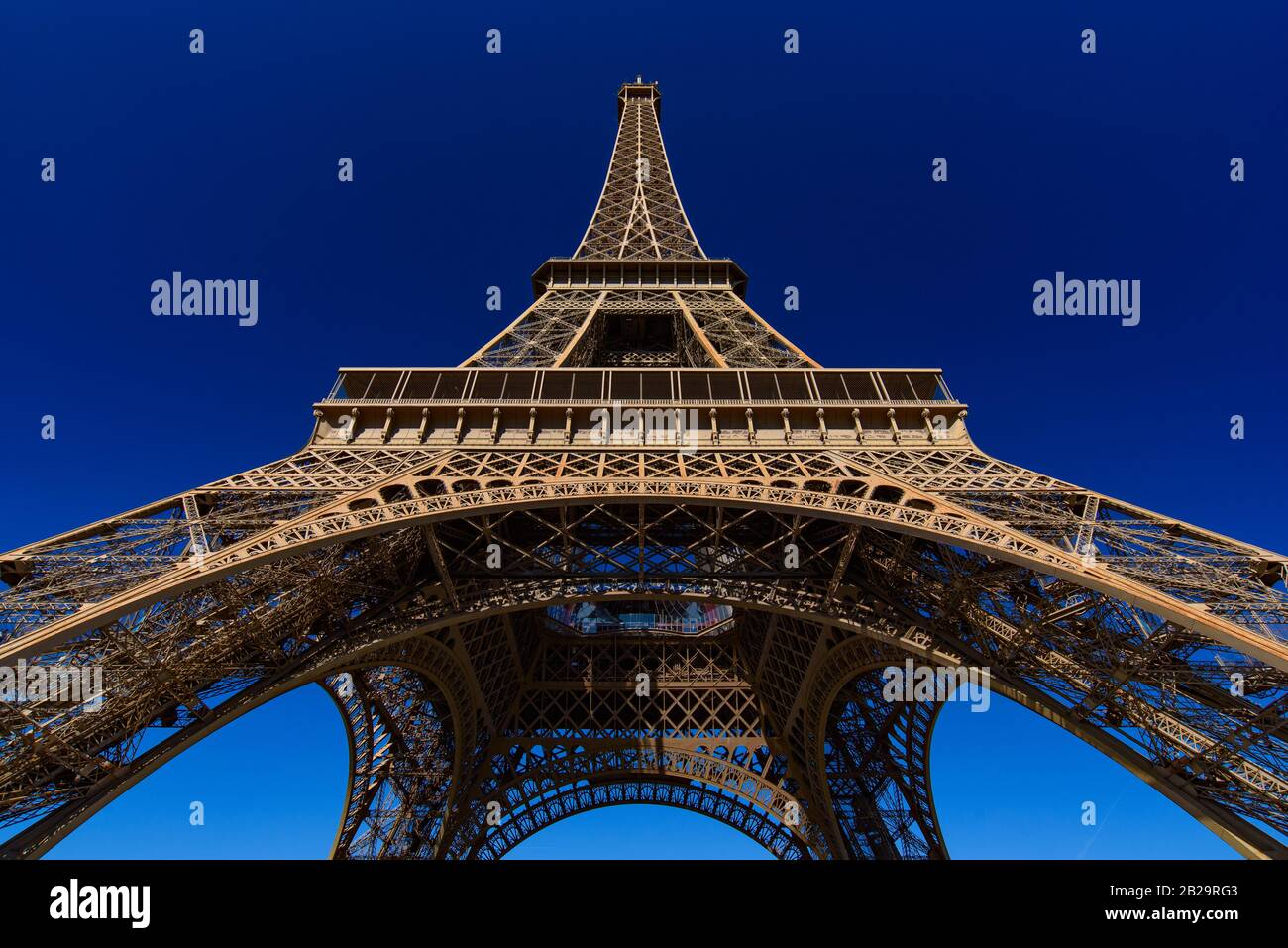 Eiffel Tower with sunny blue sky in Paris, France Stock Photo