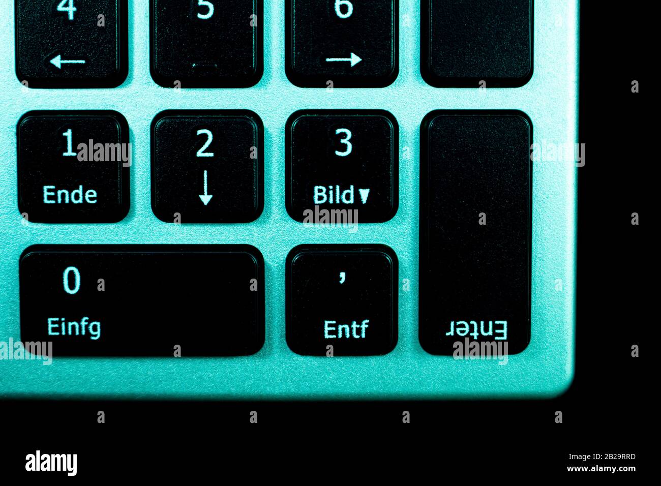 Close up view of computer keyboard with upside down enter key or button. Technical concept for computer doing the opposite that you want. Stock Photo