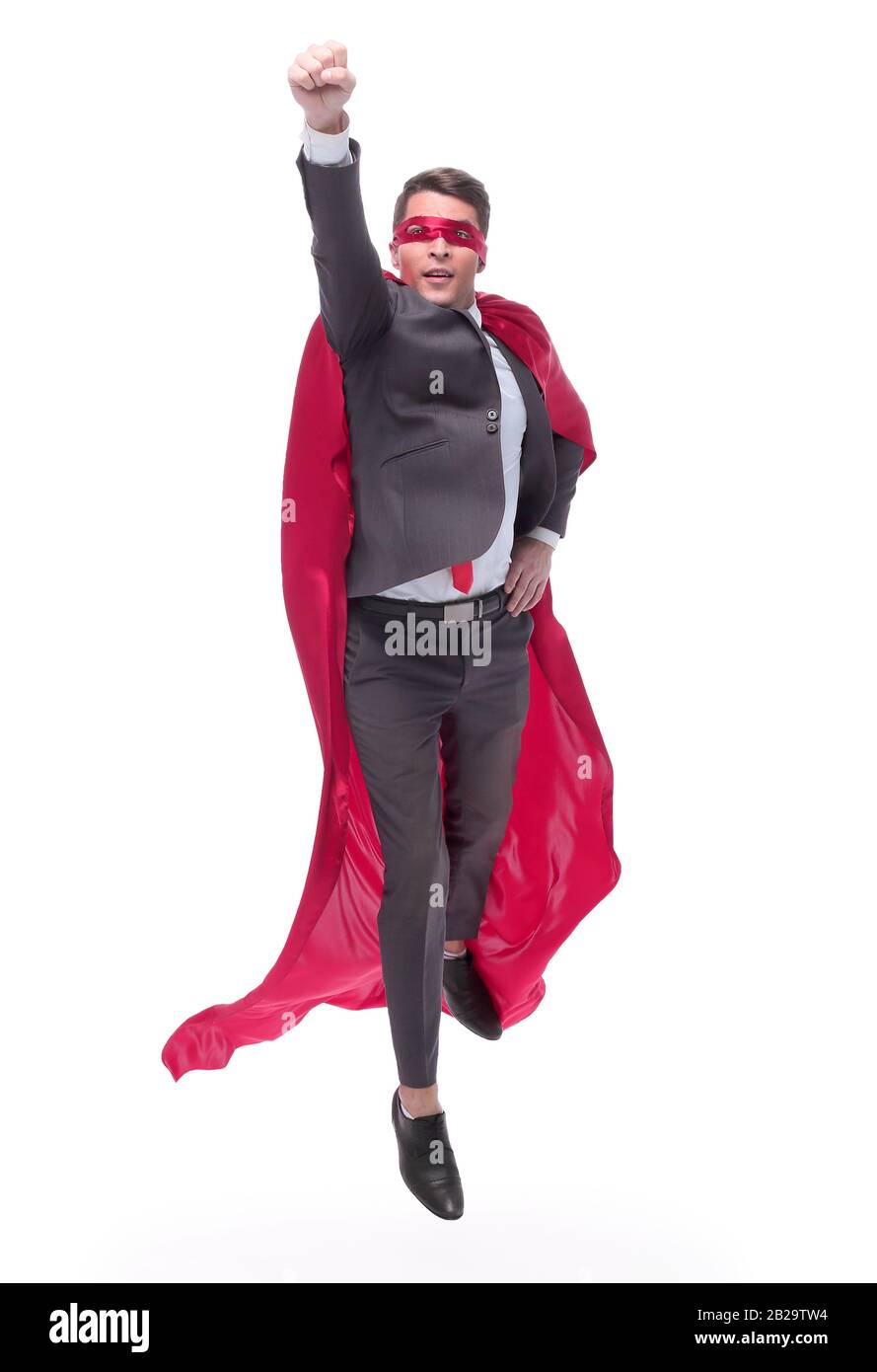 in full growth. confident superhero businessman rising up Stock Photo ...