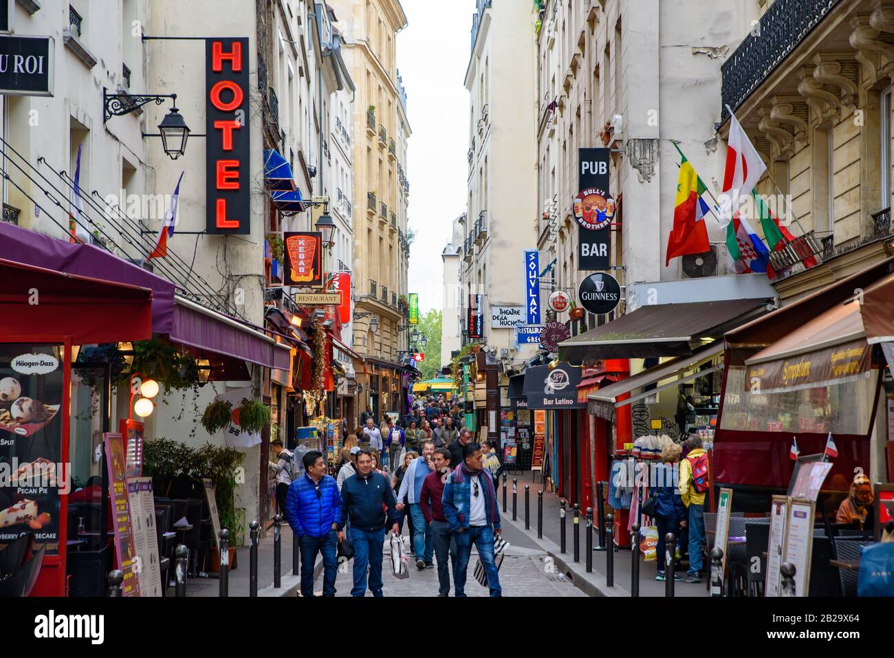 People walking on the street of Latin Quarter, the 5th arrondissement in Paris, France Stock Photo