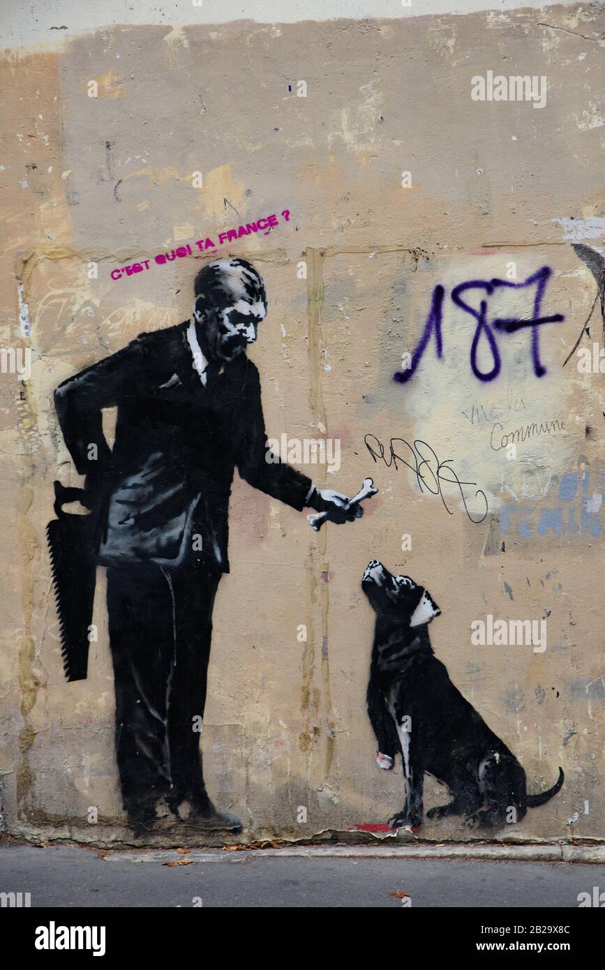 An artwork by street artist Banksy in Paris, France Stock Photo