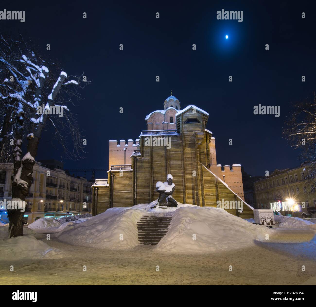 Illuminated Golden Gates and Yaroslav the Wise monument (Kiev). Winter