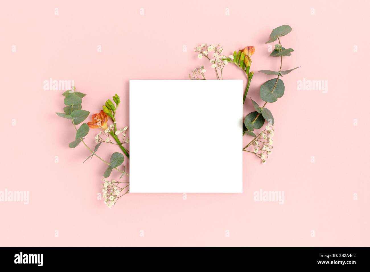 Blank paper card mockup with frame made of flowers and eucalyptus ...