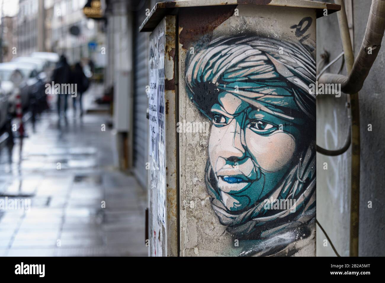 Street Art Of An Arab Boy Dressed In Desert Robes On The Side Of A