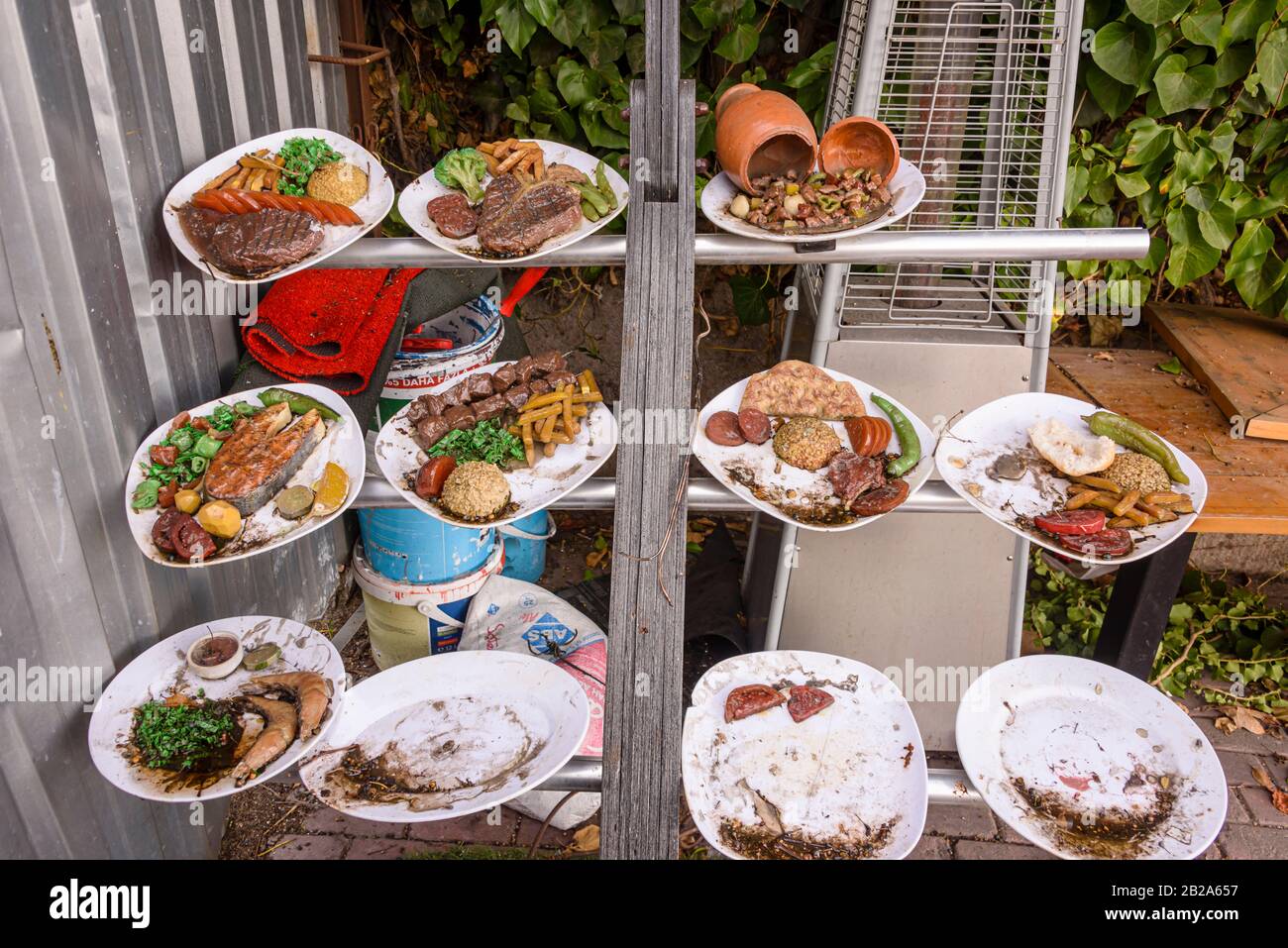 Plates of rotting food outside a former restaurant, Istanbul, Turkey Stock Photo