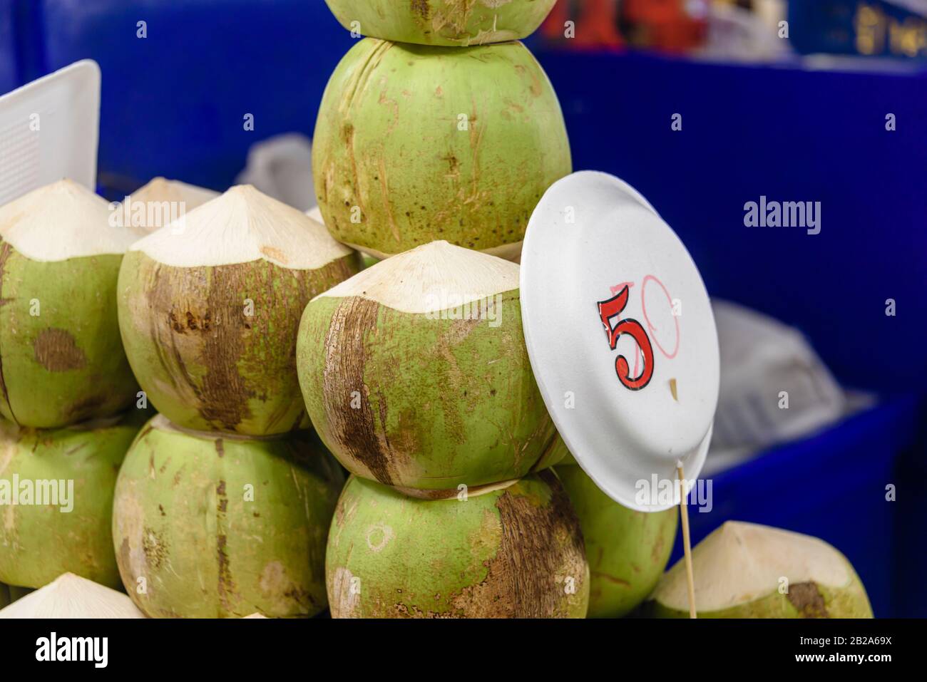 Coconuts on sale at a treet food restaurant, Bangkok, Thailand Stock Photo
