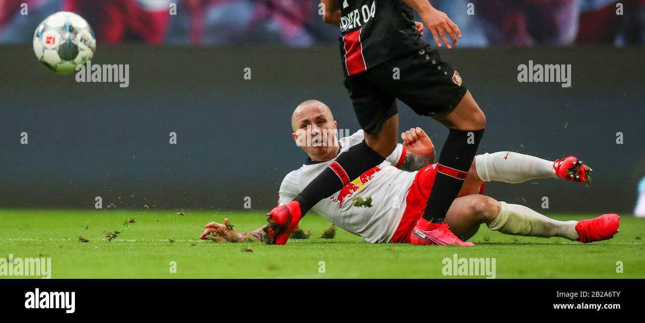 01 March 2020, Saxony, Leipzig: Football: Bundesliga, 24th matchday, RB Leipzig - Bayer Leverkusen in the Red Bull Arena Leipzig. Leipzig's Jose Angel Esmoris Tasende (Angelino) in duel with Leverkusen's Nadiem Amiri. Photo: Jan Woitas/dpa-Zentralbild/dpa - IMPORTANT NOTE: In accordance with the regulations of the DFL Deutsche Fußball Liga and the DFB Deutscher Fußball-Bund, it is prohibited to exploit or have exploited in the stadium and/or from the game taken photographs in the form of sequence images and/or video-like photo series. Stock Photo