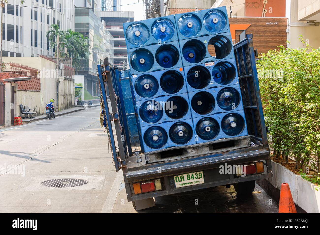 Lorry parked on a footpath while delivering water bottles, Bangkok, Thailand Stock Photo