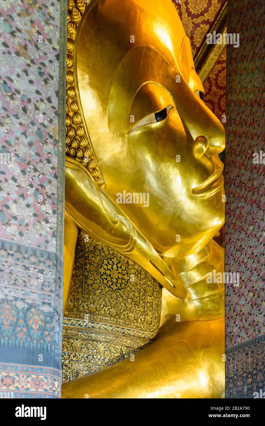 The world's oldest golden reclining Buddha at Wat Pho, Bangkok, Thailand Stock Photo