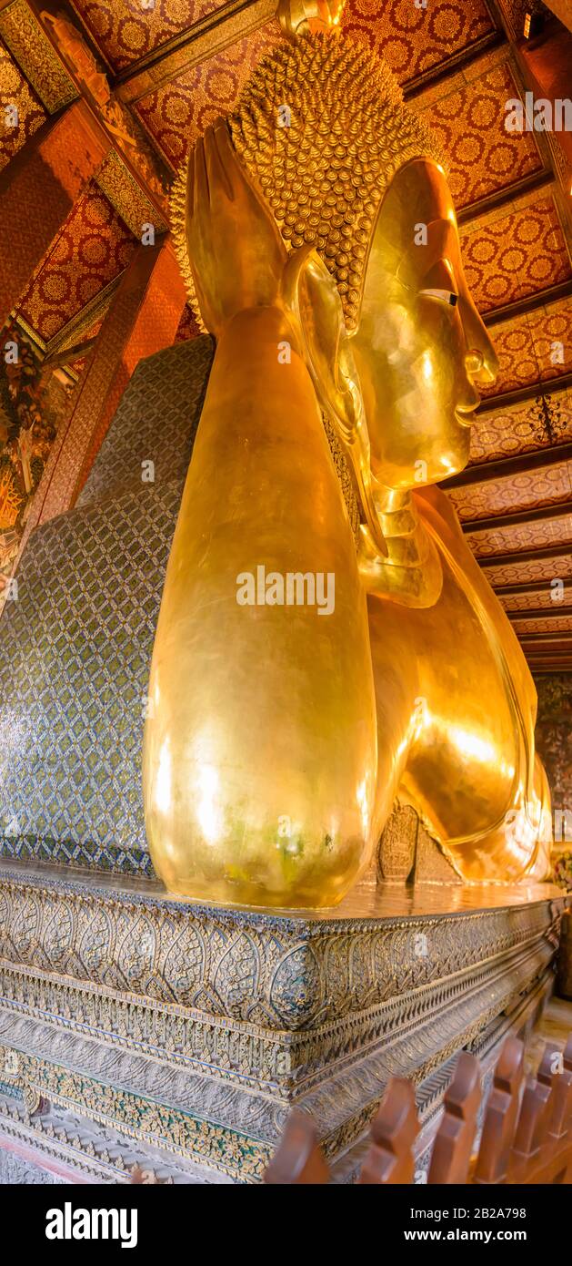 The world's oldest golden reclining Buddha at Wat Pho, Bangkok, Thailand Stock Photo
