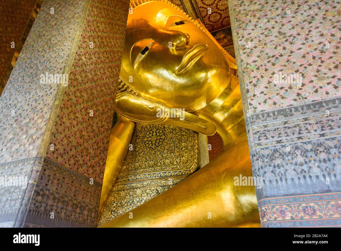 The world's oldest golden reclining Buddha at Wat Pho, Bangkok, Thailand Stock Photo