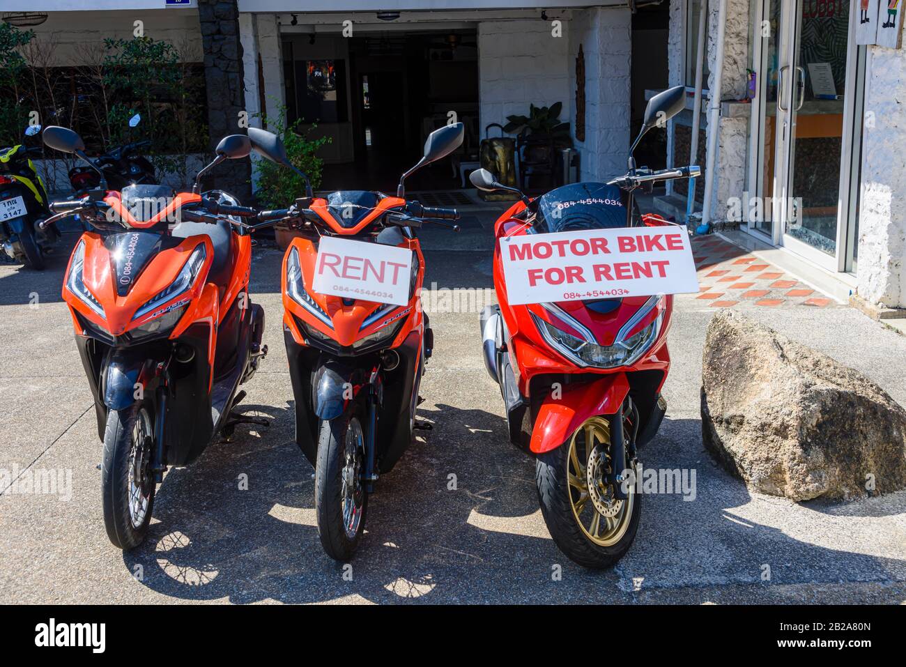 Motorbikes and scooters for rent, Kata, Thailand. Stock Photo