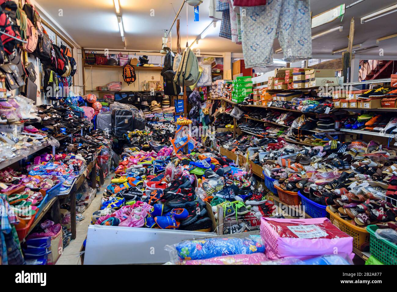 Very messy shoe and bag shop, Phuket, Thailand Stock Photo