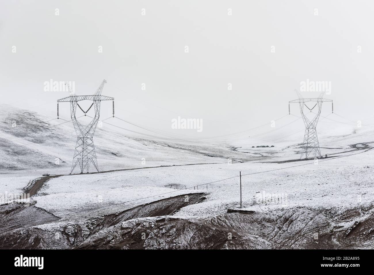 electricity pylon on a mountain which covered with snow Stock Photo - Alamy