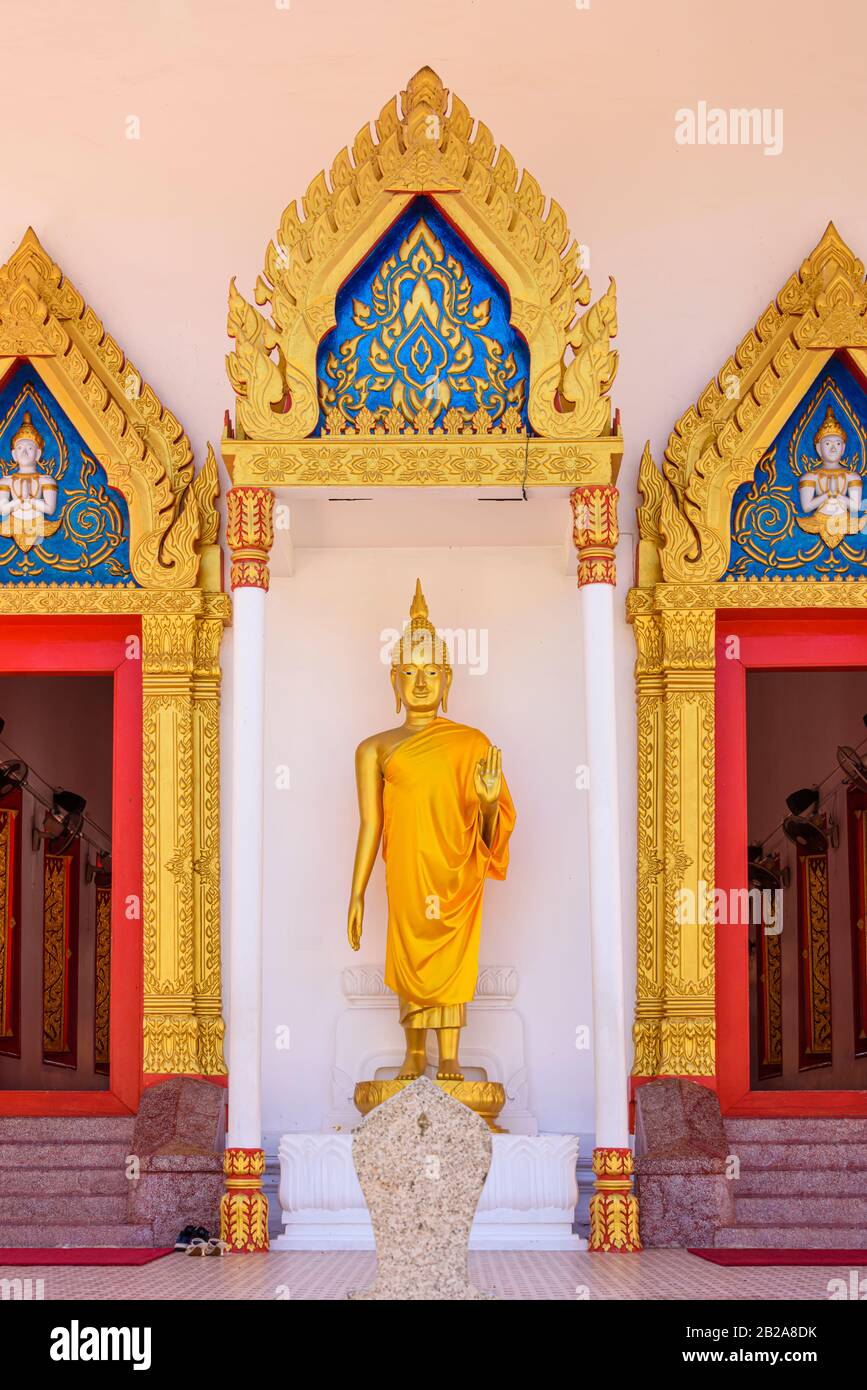 Statue of a Golden Buddha outside the doors of Wat Mongkhon Nimit