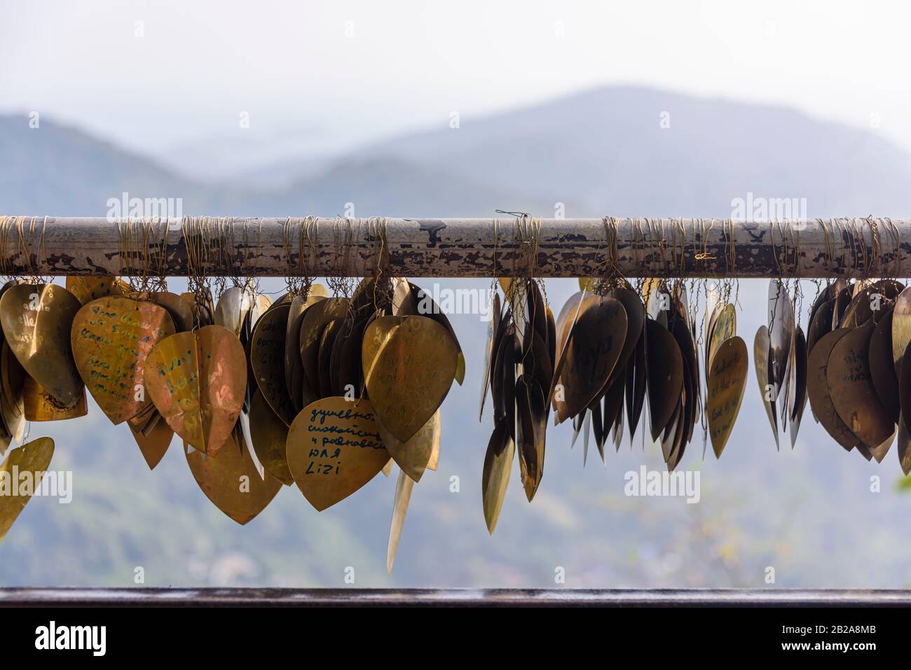 Messages of peace and love written on bronze hearts at the Big Buddha, Phuket, Thailand Stock Photo